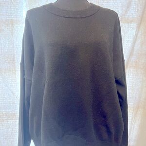 Black crew neck sweater.